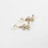 Boucles d'oreille CHANEL perles en verre et strass