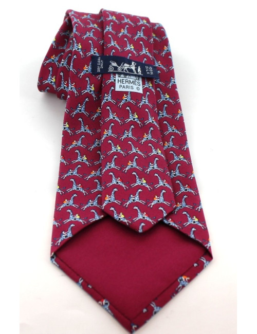 Cravate HERMES en soie bordeaux imprimé chevaux