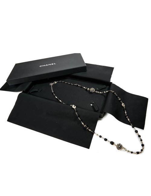 Sautoir CHANEL chaîne dorée et perles noires