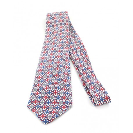 Cravate HERMES en soie imprimée fleur de lys (bleu, gris et rouge)