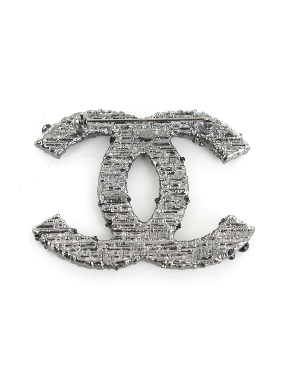Broche CHANEL métal argenté avec strass et perles noires