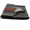 Gucci grained leather pouch and butterfly brooch