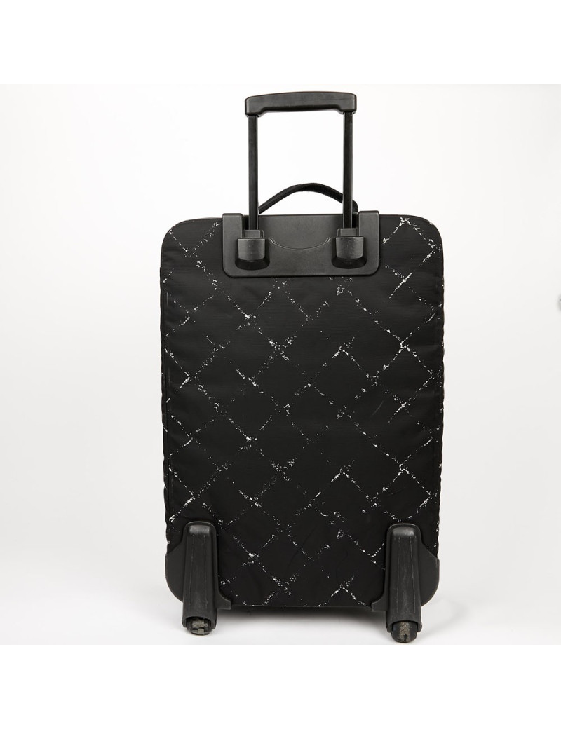  a reparer  roue Valise CHANEL en toile 