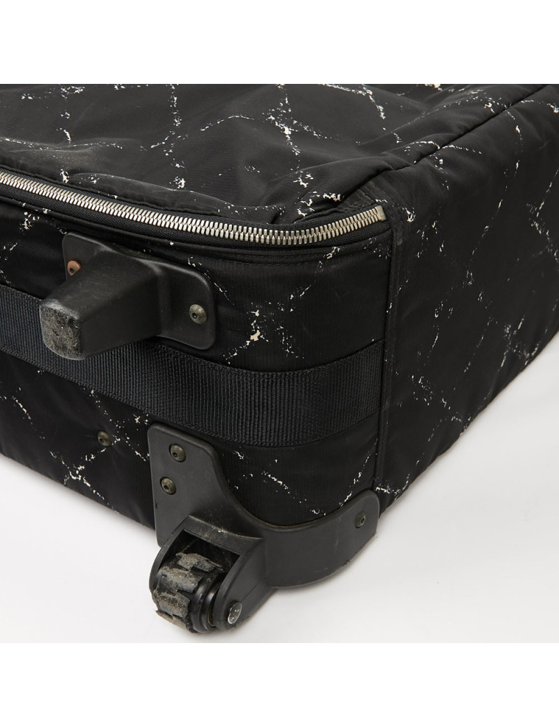  a reparer  roue Valise CHANEL en toile 