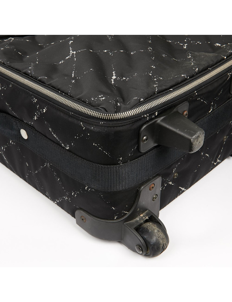  a reparer  roue Valise CHANEL en toile 