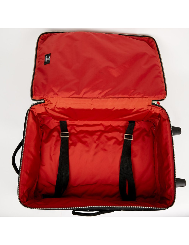  a reparer  roue Valise CHANEL en toile 