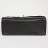 CHANEL Flap bag in black smooth and quilted leather