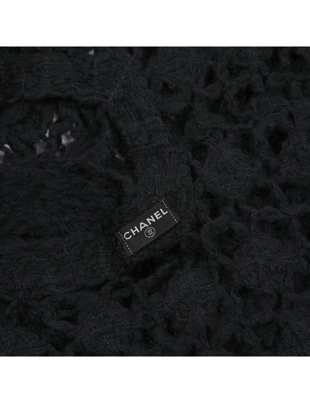 Etole CHANEL tricotée en laine noire