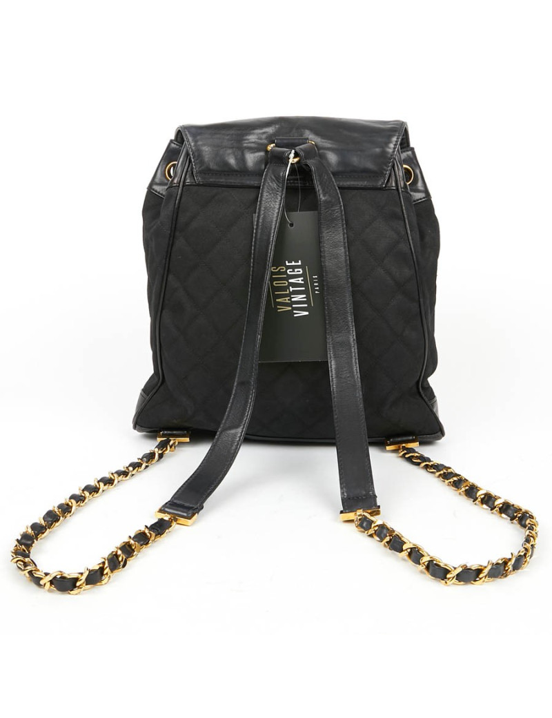 Sac a dos vintage CHANEL en toile et cuir bleu marine