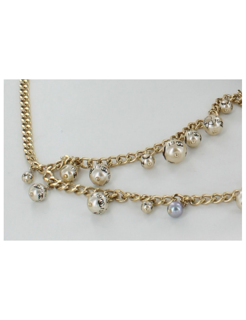 Ceinture/ sautoir CHANEL en métal doré serti de perles nacrées 