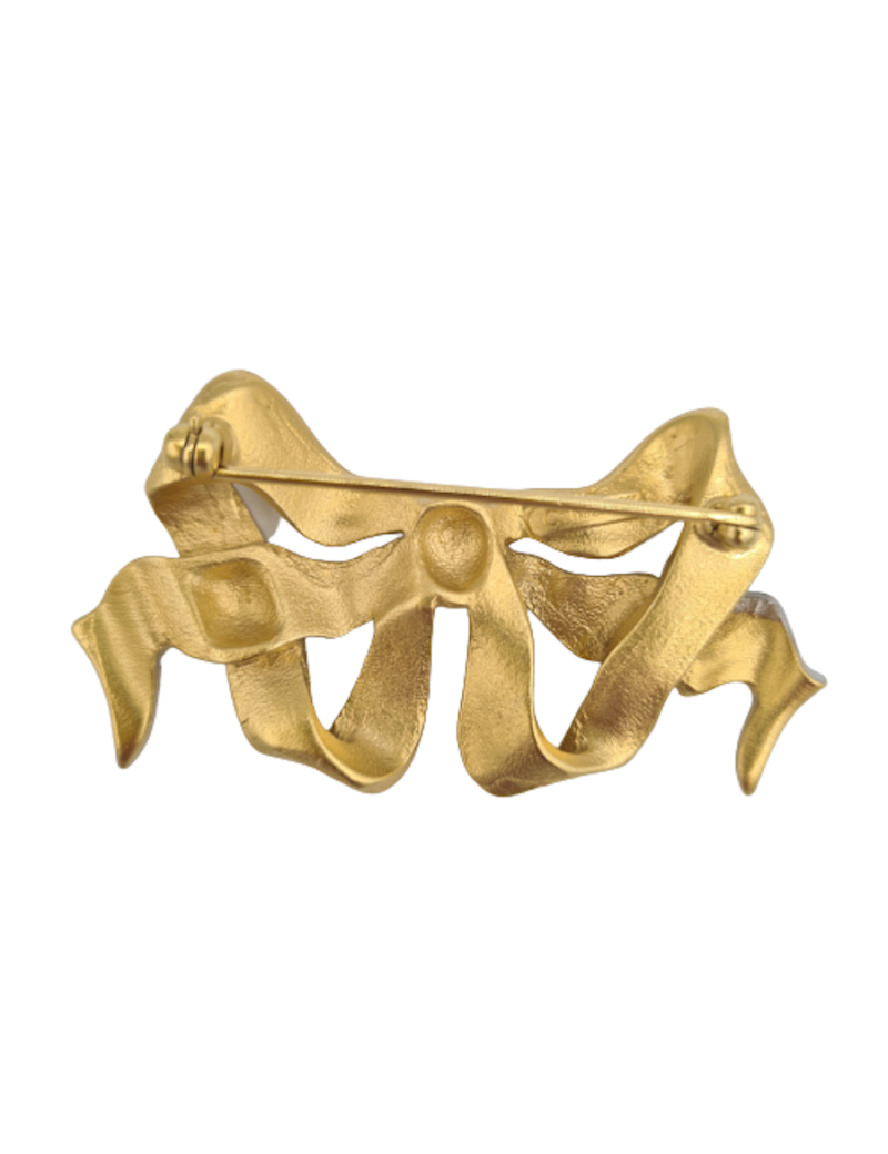 Broche NINA RICCI noeud doré