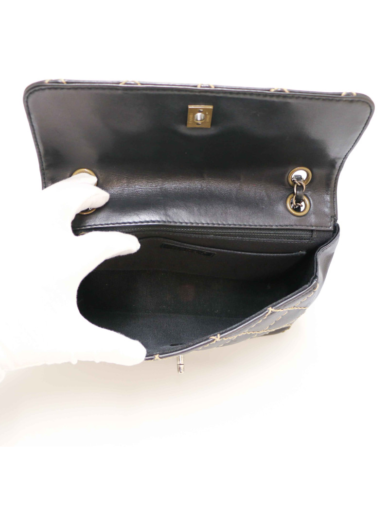 Sac CHANEL noir coutures beige