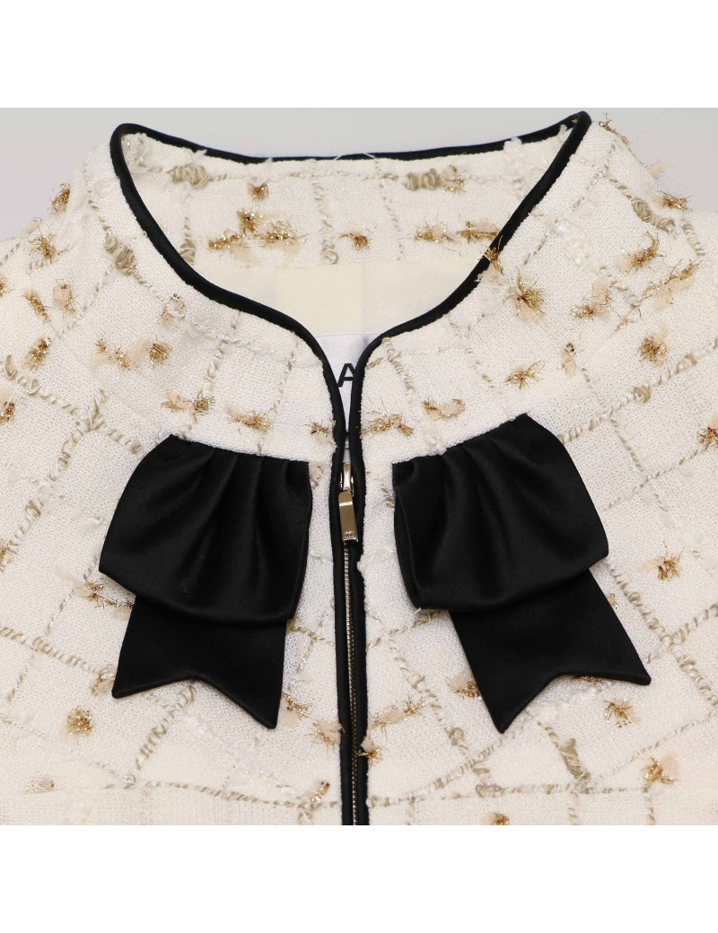 Veste CHANEL blanc et doré gansé de noir