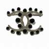 Broche CHANEL CC perles noires strass