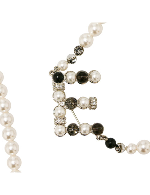 CHANEL long necklace with C H A N E L brooches