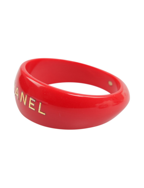 CHANEL red resin and gold inscription bracelet