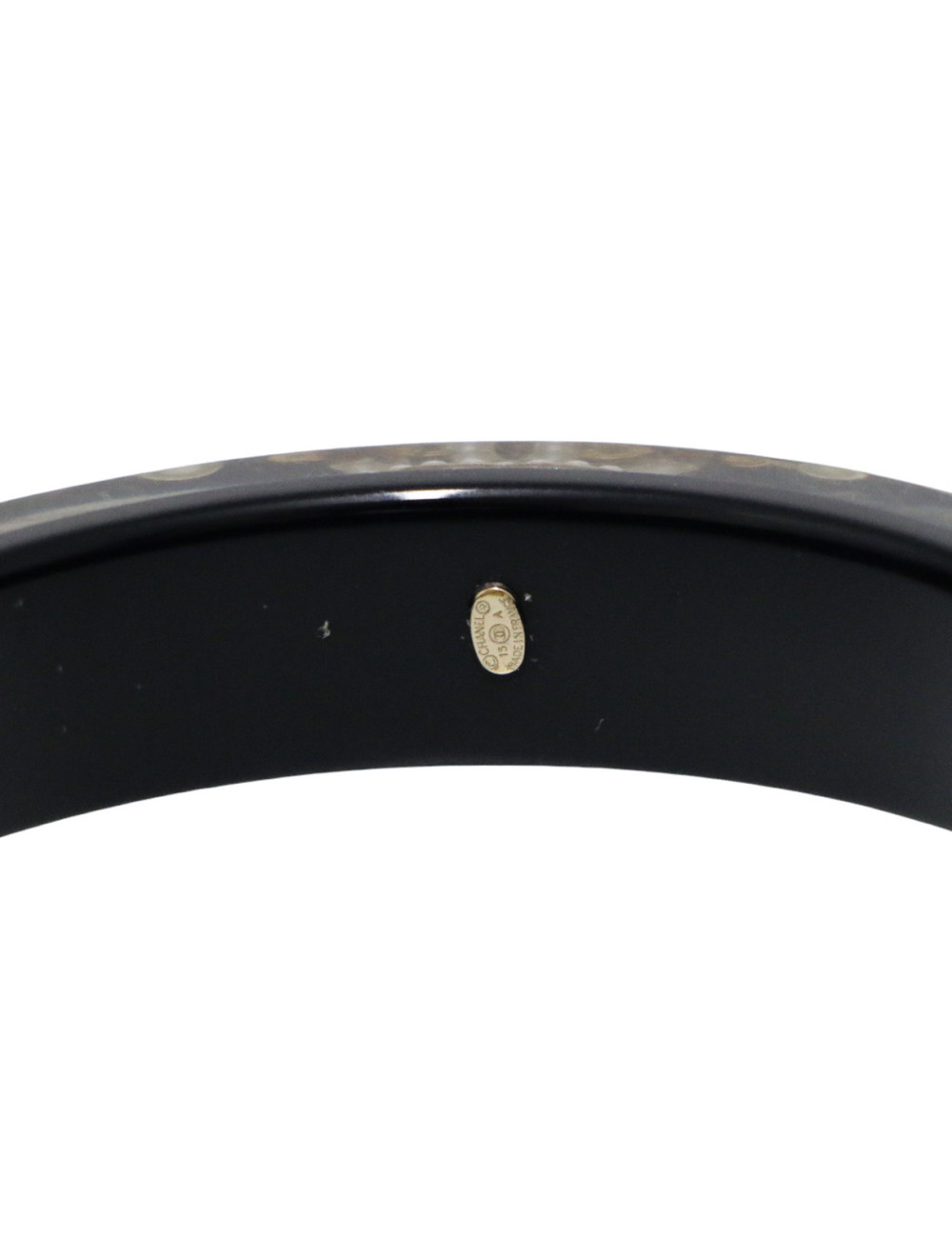 Bracelet CHANEL résine noir incrusté de chaine dorée