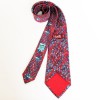 Cravate HERMES en soie rouge motifs fleurs