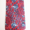 Cravate HERMES en soie rouge motifs fleurs