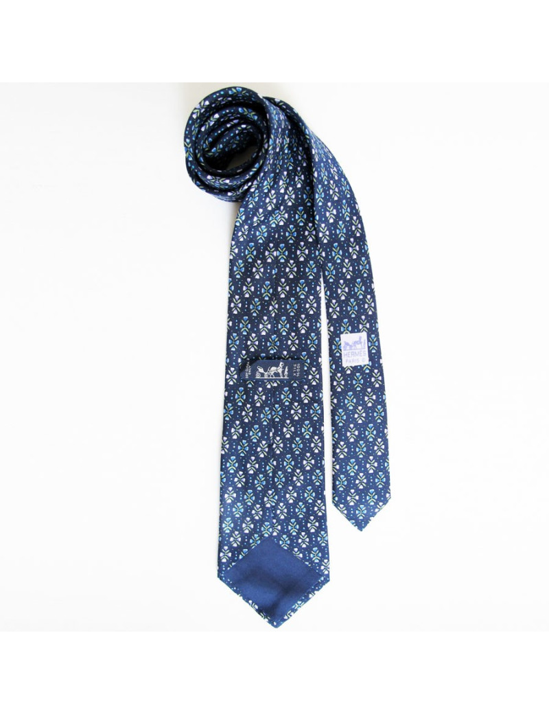 Cravate HERMES en soie bleu motifs fleurs