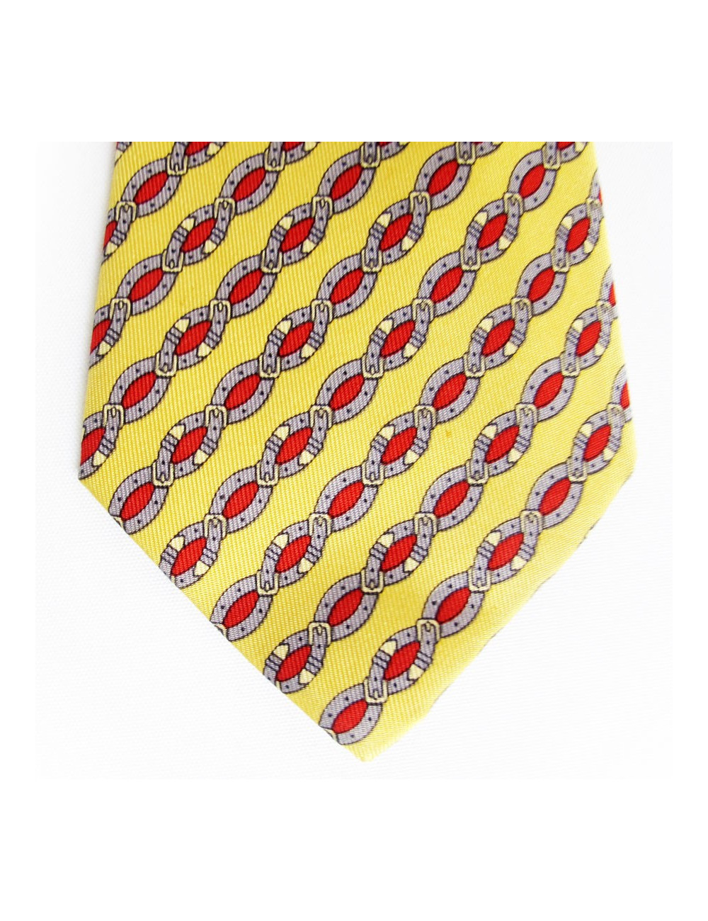 Cravate HERMES en soie jaune motifs ceintures