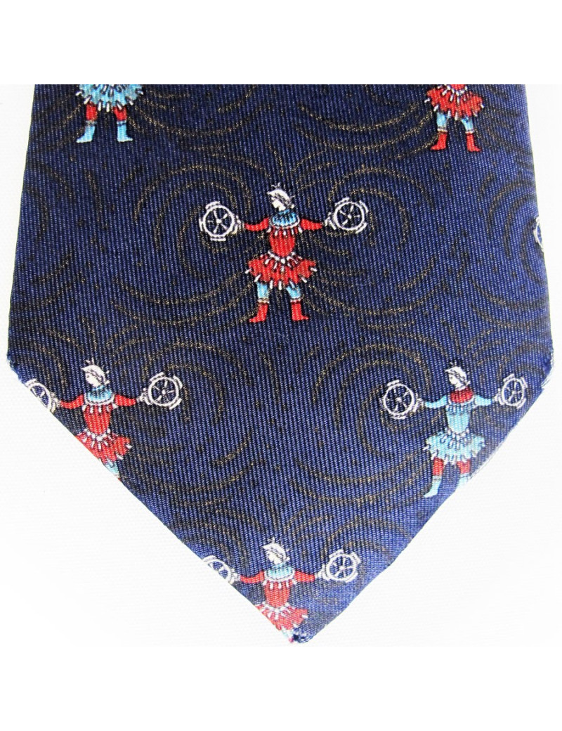 Cravate bleu nuit HERMES avec des imprimés de jongleurs