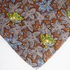 Cravate marron HERMES avec imprimés floraux et paillons
