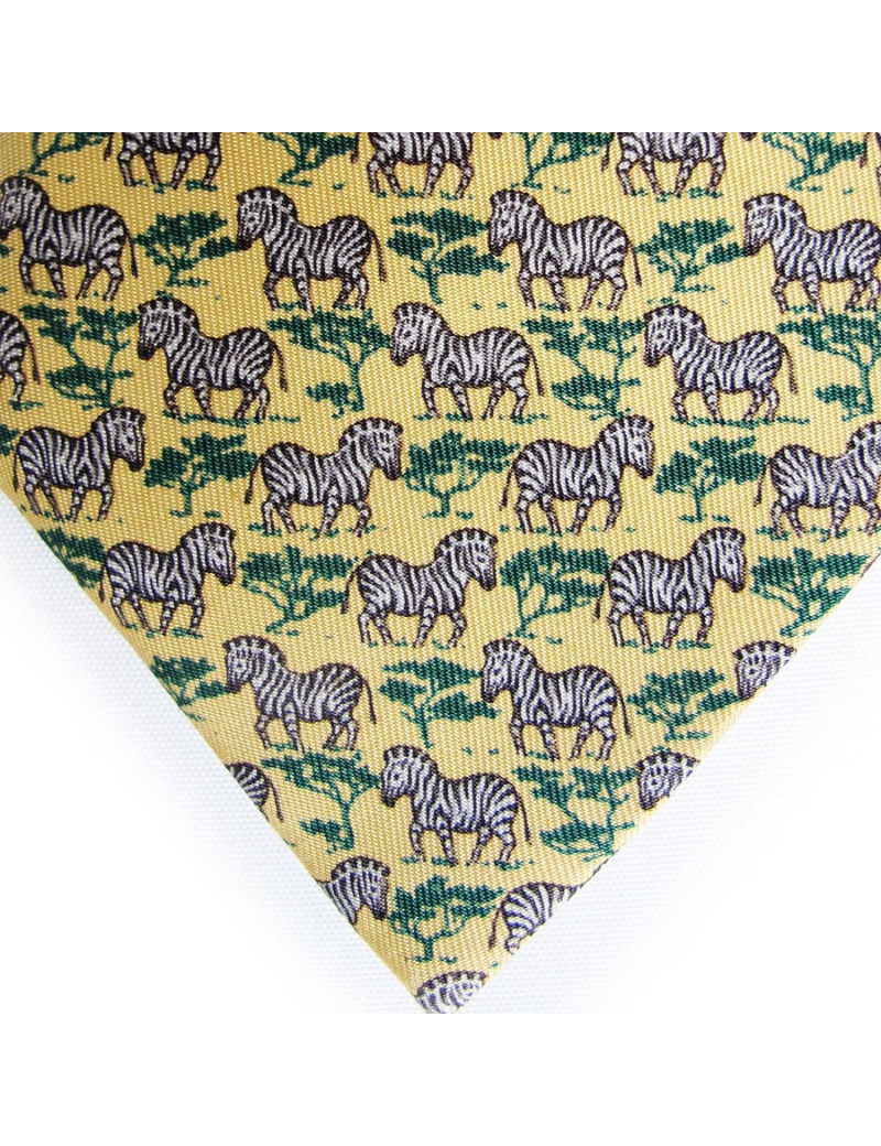 Cravate HERMES en soie jaune motifs zebres
