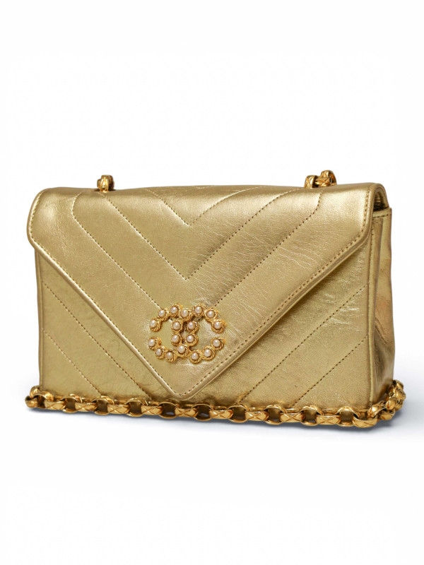 Sac du soir Chanel cuir doré chevrons