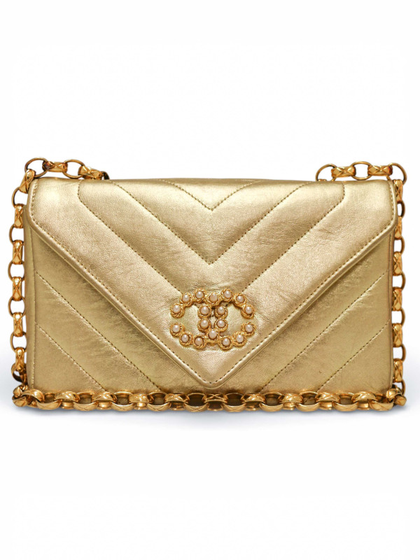 Sac du soir Chanel cuir doré chevrons