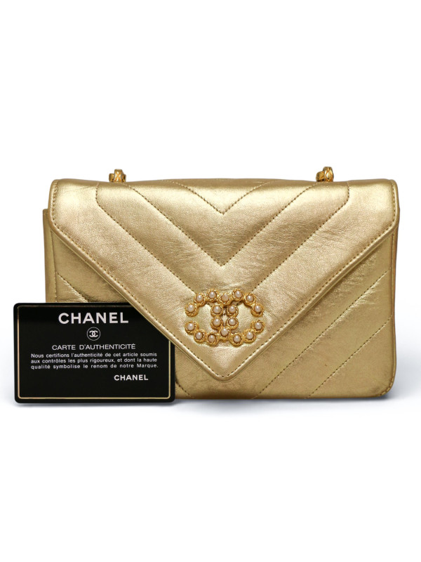 Sac du soir Chanel cuir doré chevrons