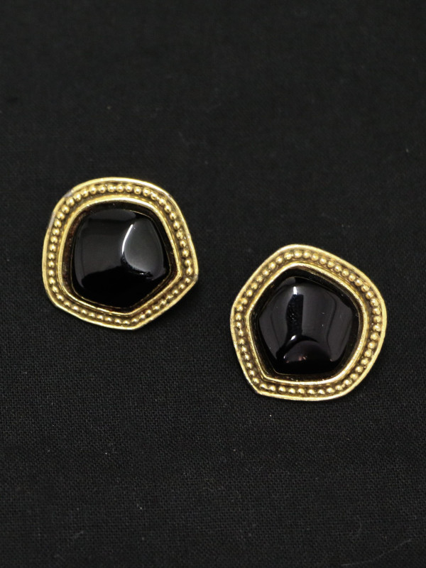Clips dorés et résine noire Yves Saint Laurent