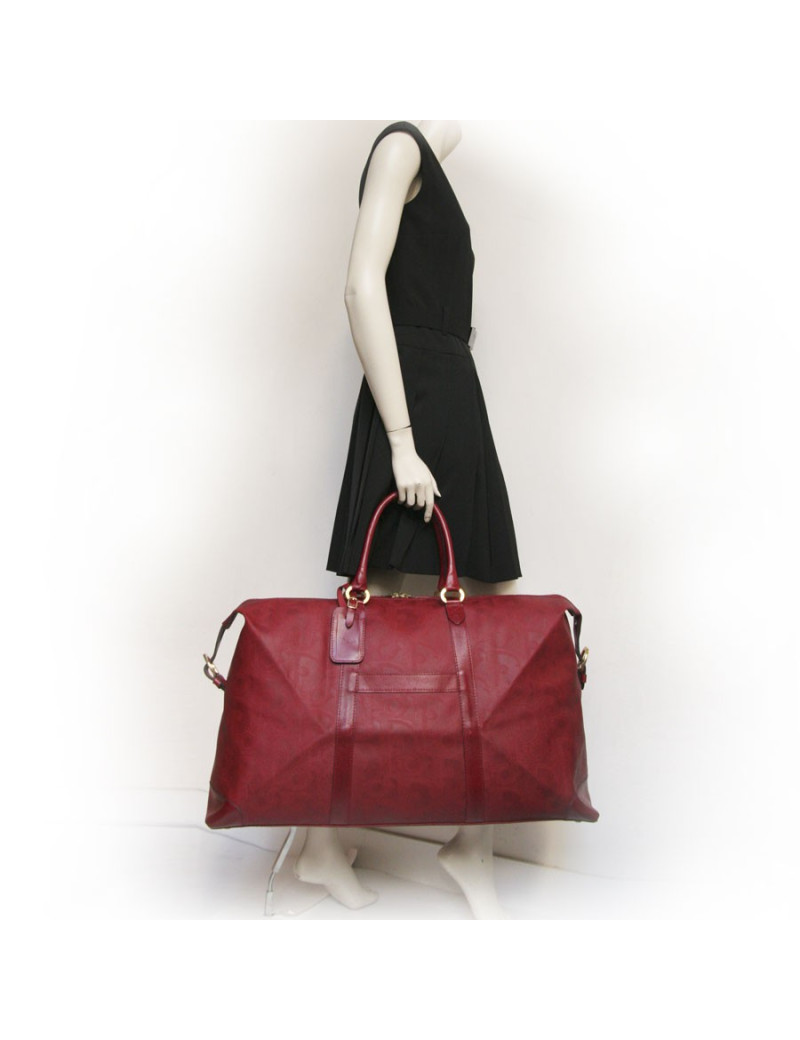 Sac de voyage DIOR en toile embossée rouge