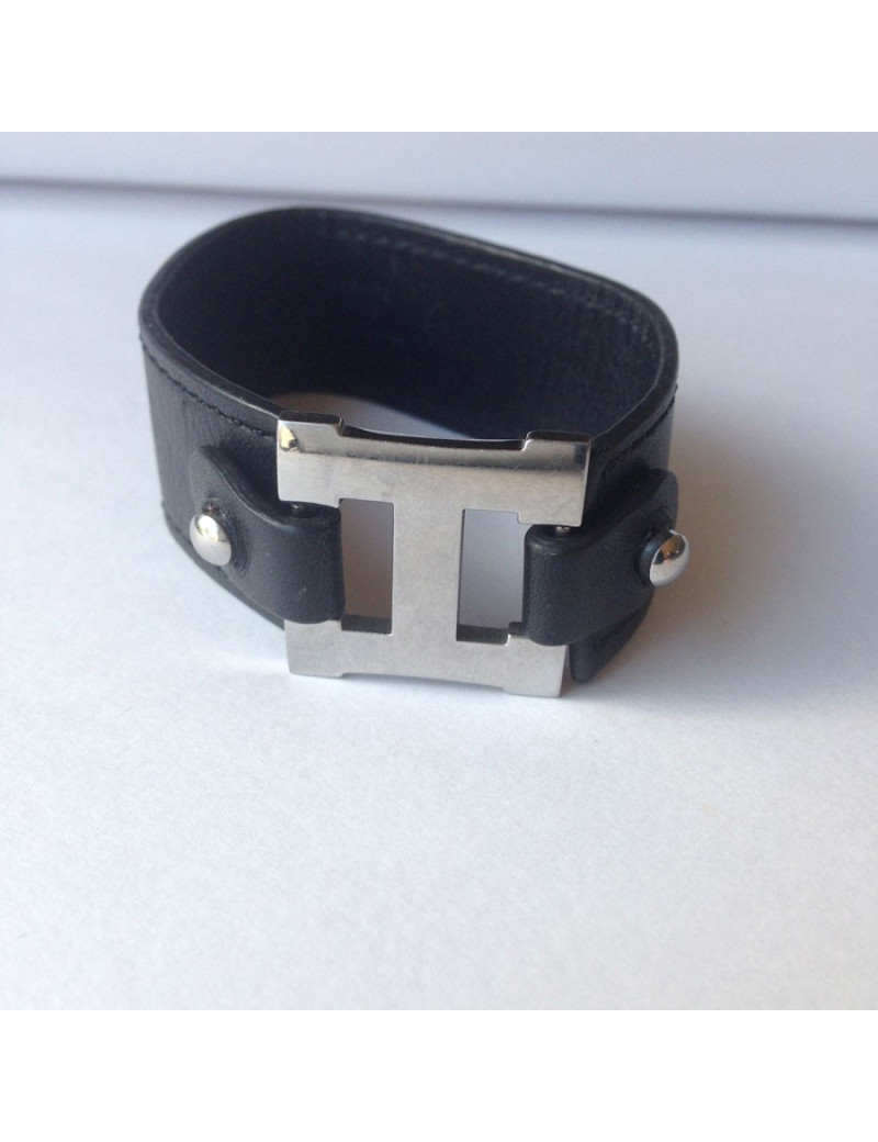 Bracelet HERMES cuir noir et "H" palladié