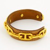 Bracelet rigide chaine d'ancreHERMES doré et cuir gold