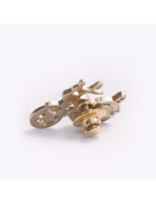 Pin' s CHANEL moto or pâle