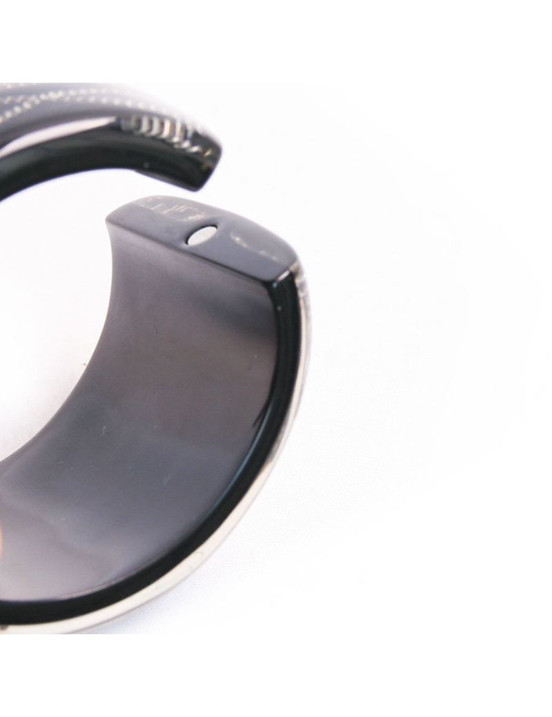 Manchette CHANEL noire avec inclusion chaînes et brillants