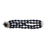 Bracelet à perles noires facettées et fleur en strass