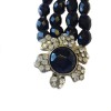 Bracelet à perles noires facettées et fleur en strass