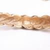 Bracelet couture CHANEL en métal torsadé doré vieilli 