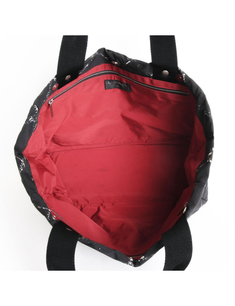 Sac cabas CHANEL noir et blanc "ligne voyage"