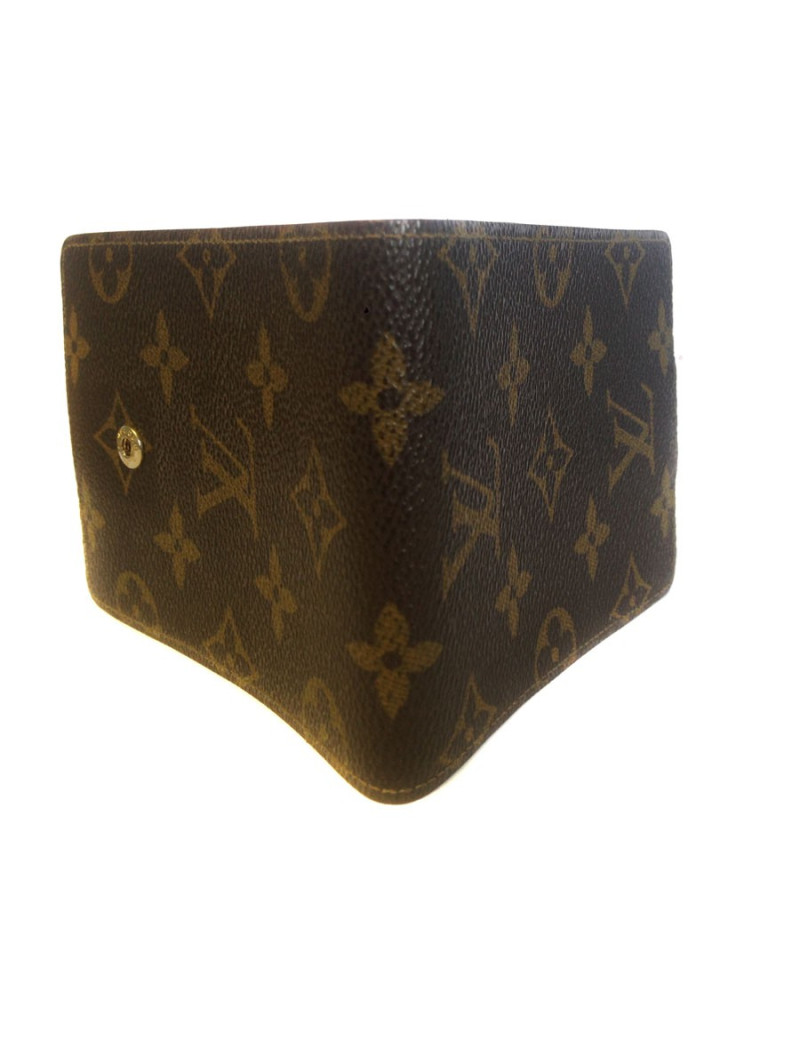 Wearing LOUIS VUITTON checkbook in monogrammed and leather coated canvas