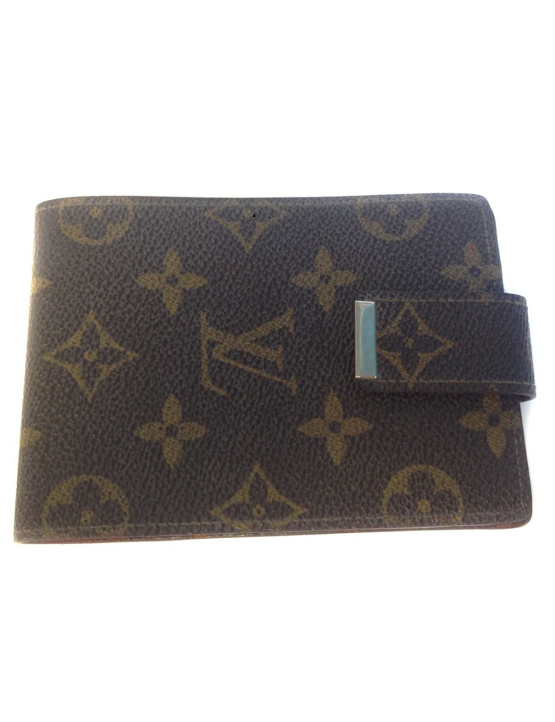 Wearing LOUIS VUITTON checkbook in monogrammed and leather coated canvas