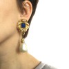 Unsigned pair of clip-on earrings in gilded metal and pearl