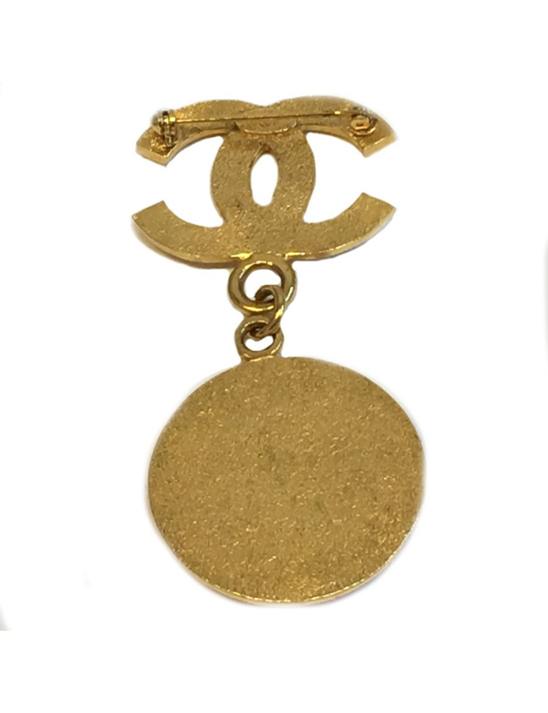 Broche CHANEL CC et pièce en métal doré
