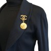 CHANEL CC brooch with a medallion in gilded metal