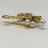 PIN CHANEL in gilded metal, pearls and rhinestones