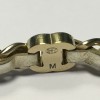 Bracelet CHANEL en métal doré entrelacé de cuir