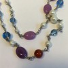 CHANEL necklace in multicolored pearls and CC