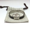 Bracelet clic H HERMES en émail noir mat et palladié mat brossé